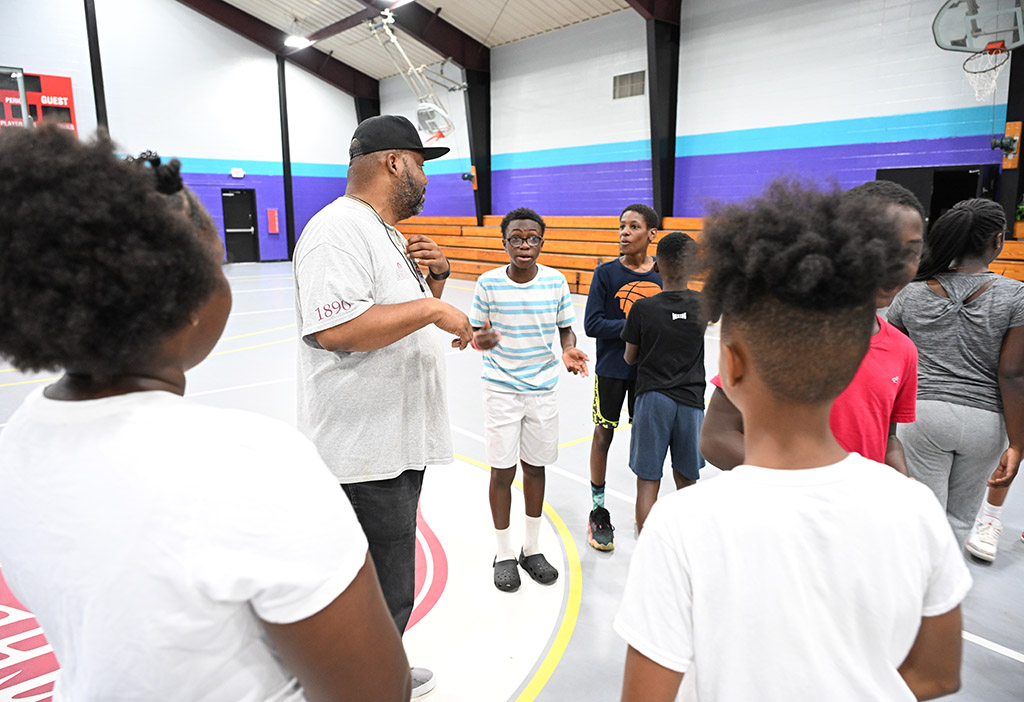 UMES Extension educator McCoy Curtis works with a youth group on developing physical activity skills.