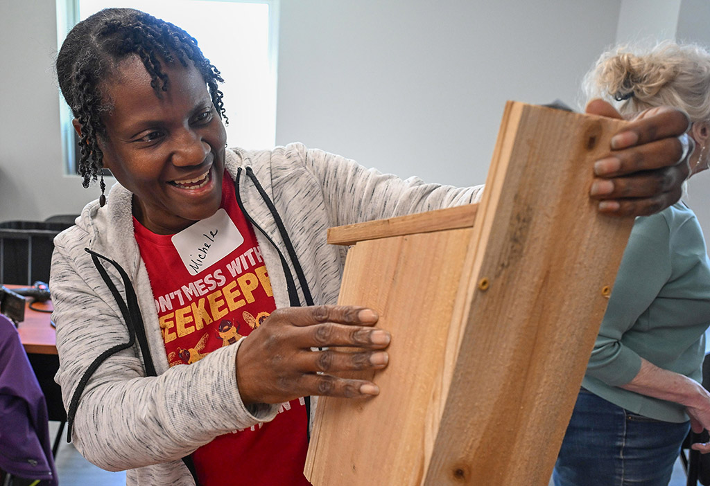 Michele, a University of Maryland Eastern Shore Extension workshop participant, builds a birdhouse.