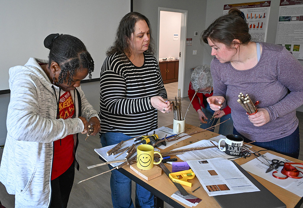 Workshop participants put together a nest for native bees.