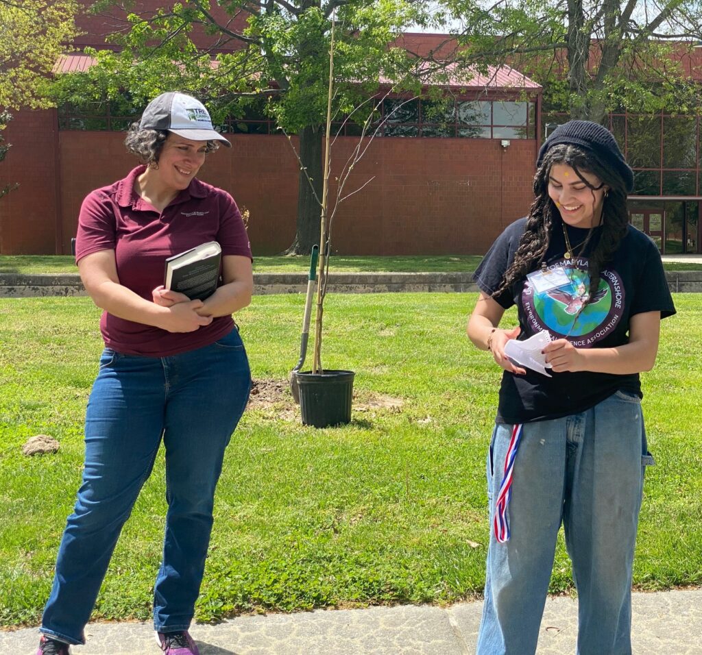 Environmental Science Association student Sarah Rawlinson, right, and Associate Professor Stephanie Stotts take part in Earth Day celebration.