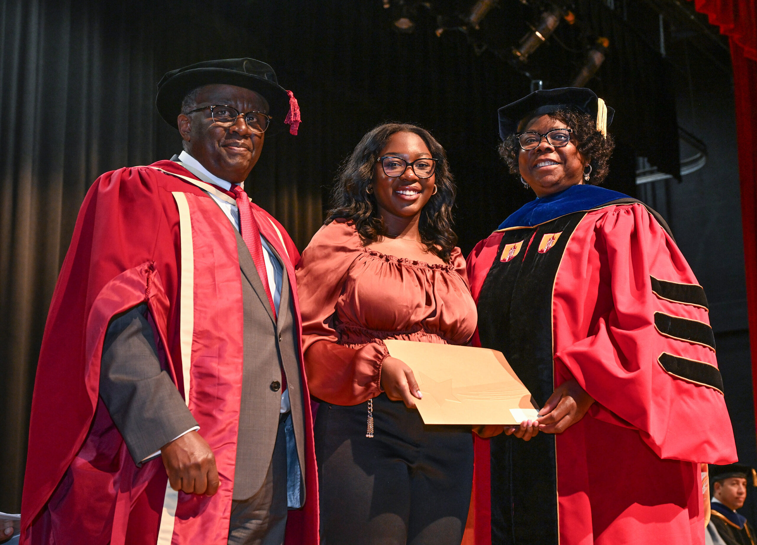 Tracy Ewli-Kwakutse, Dept. of Human Ecology winner, with Department Chair Dr. Grace Namwamba and Dean Dr. Moses T. Kairo.