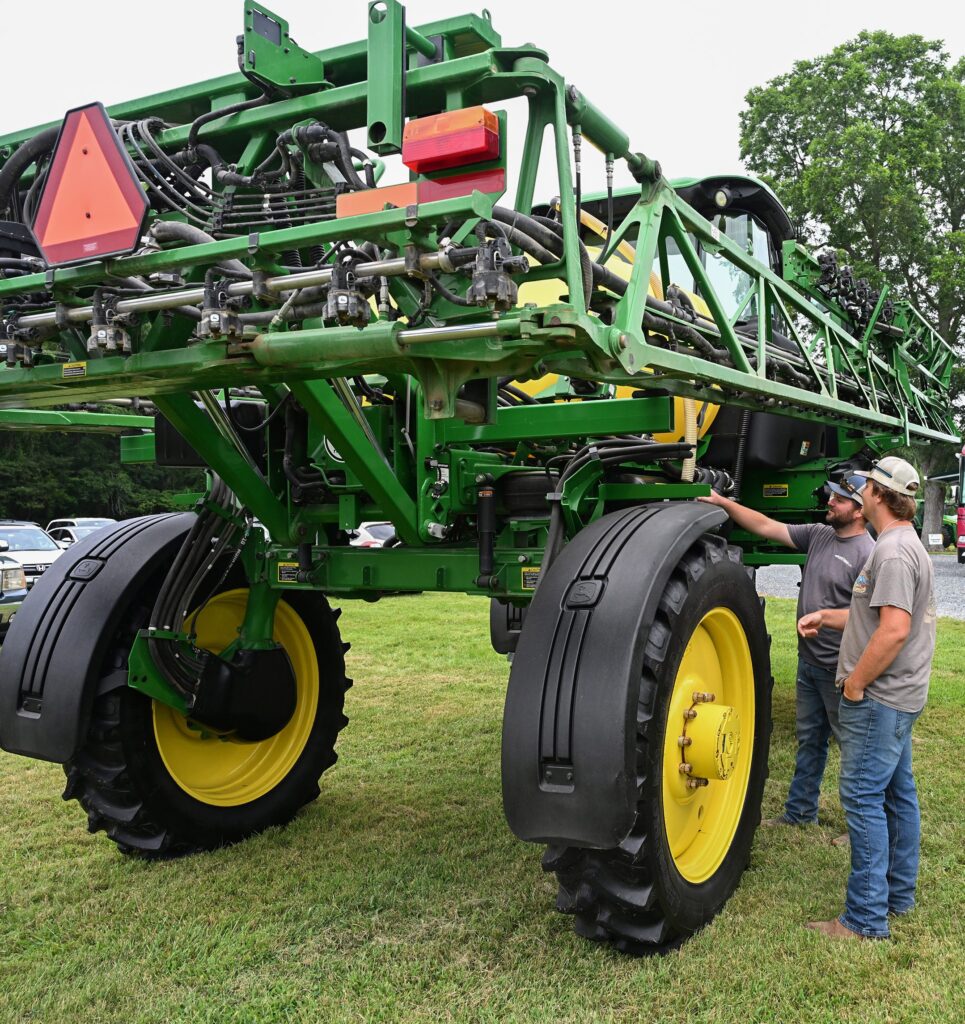 Austin and Aaron Meredith look at farm equipment on display at Ag Showcase.