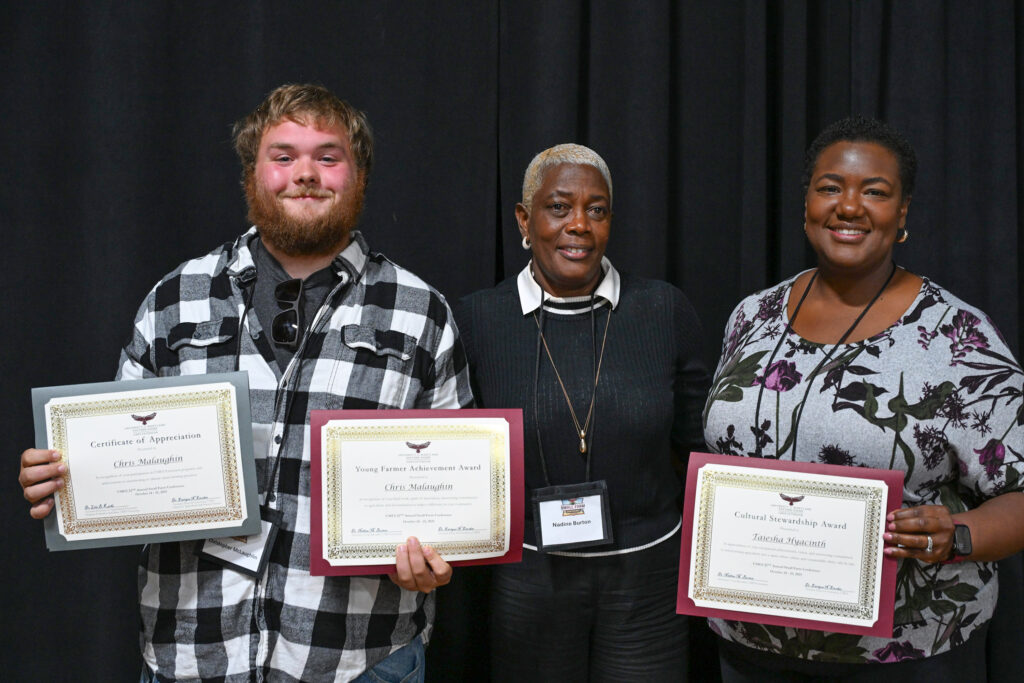 University of Maryland Eastern Shore alternative crop specialist Dr. Nadine Burton, center, with award winners, Chris Malaughlin, left, and Taieshia Hyacinth, right.