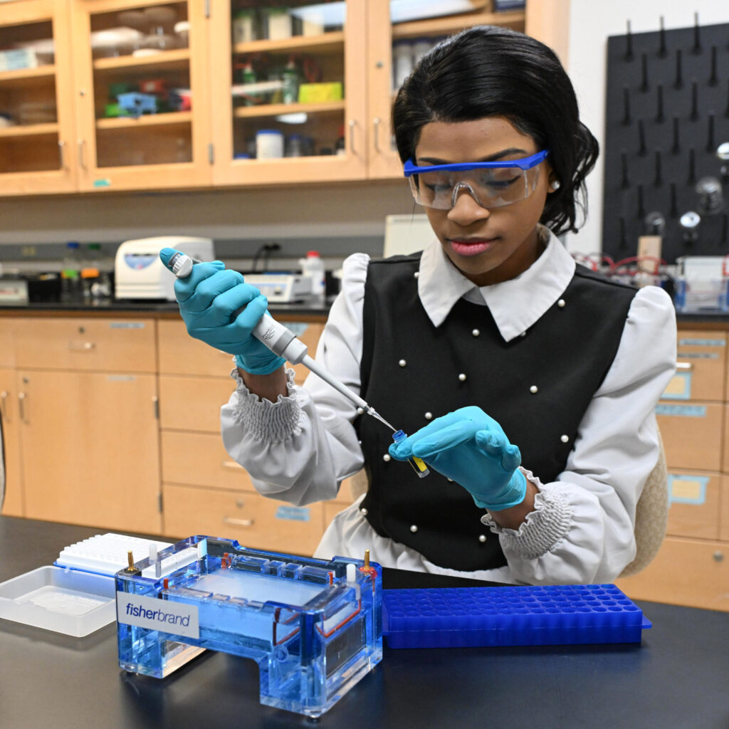 University of Maryland Eastern Shore biochemistry major Alexandra Camp performs an experiment in a chemistry lab on campus.