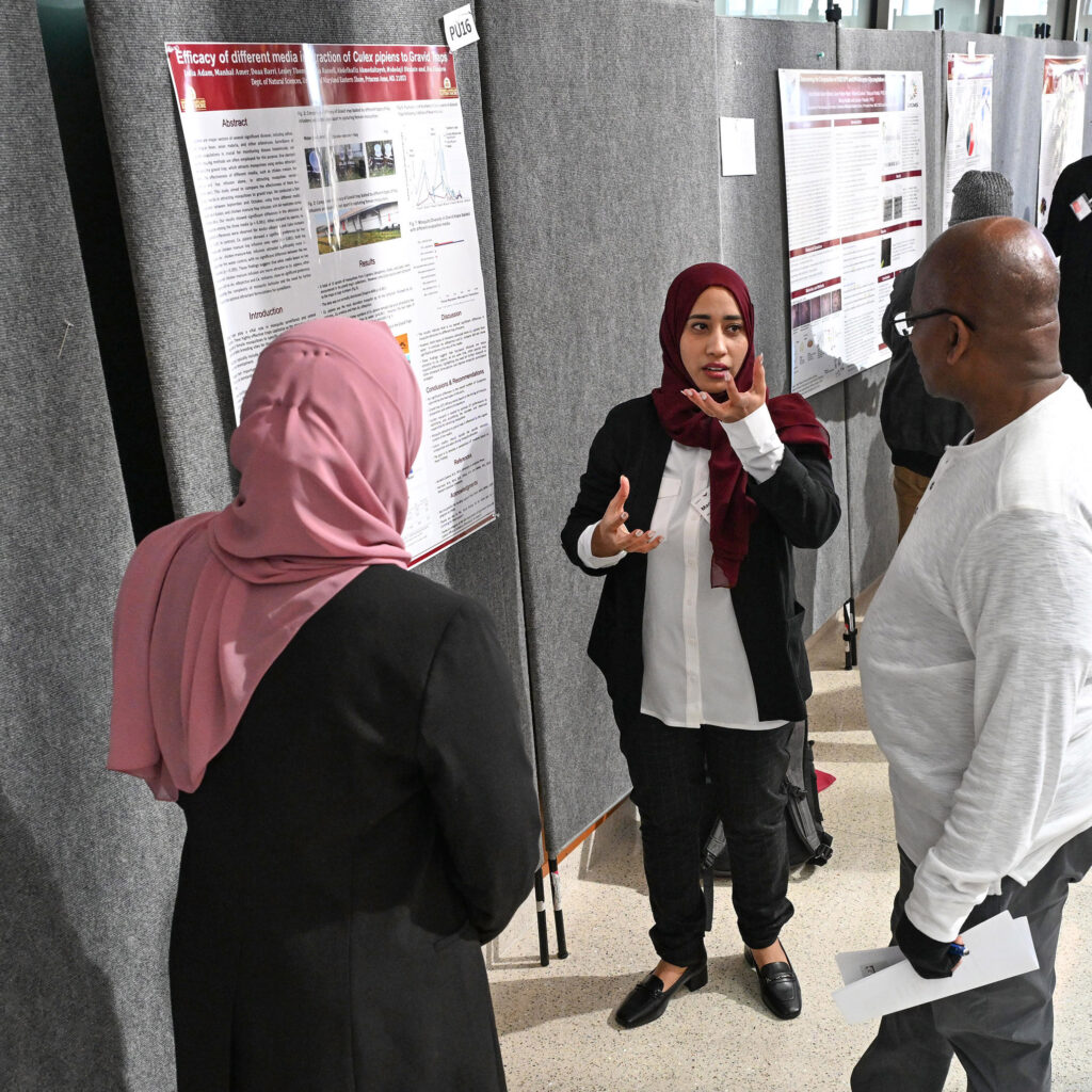 Students discuss their research posters at the inaugural UMES Student-led Undergraduate Research Symposium.