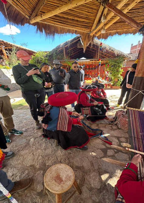 Peruvian weavers demonstrate natural textiles and dyes woven into traditional fabrics.