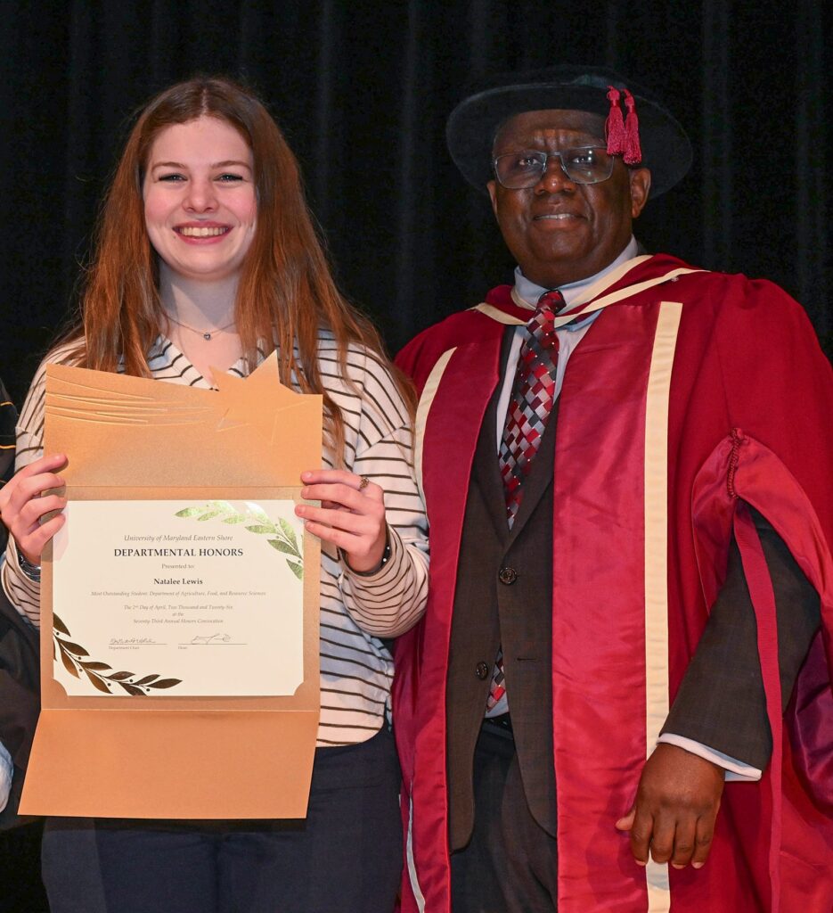 Natalee Lewis holds a certificate recognizing her as the outstanding student for UMES' Department of Agriculture, Food and Resource Sciences at the 73rd Honors Convocation. Dr. Moses T. Kairo, dean of the School of Agricultural and Natural Sciences, pictured with her, presented the award.
