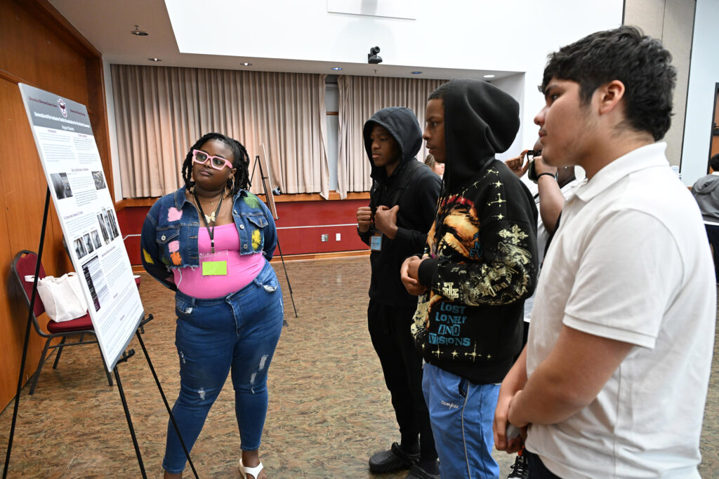 Aryaun Stevens, a UMES fashion merchandising major at UMES, presents her research poster.