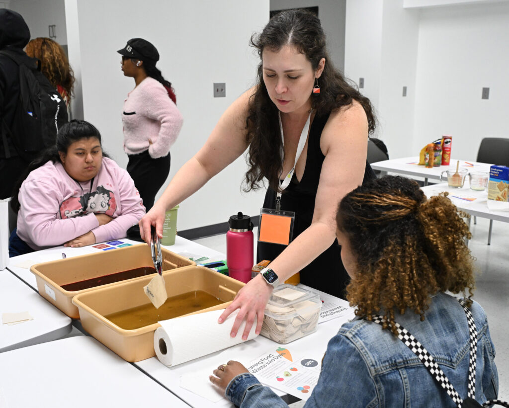 Maureen Brewster, an assistant professor of fashion merchandisng at UMES, demonstrates dyeing textiles with natural dyes.