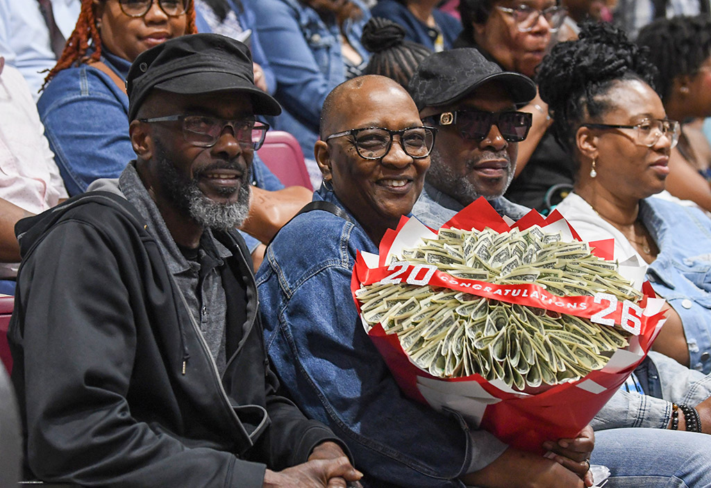 Lawerence Zantt and Gwen Zantt hold a money Bouquet for their granddaughter Mar'Shay Robinson during the 139th Spring Commencement.
