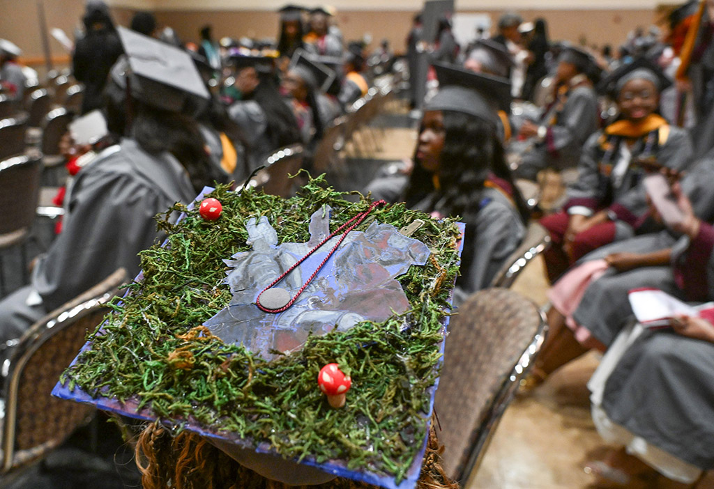 Amber Gray of Hurlock dons her mushroom mortar board during the 139th Spring Commencement.