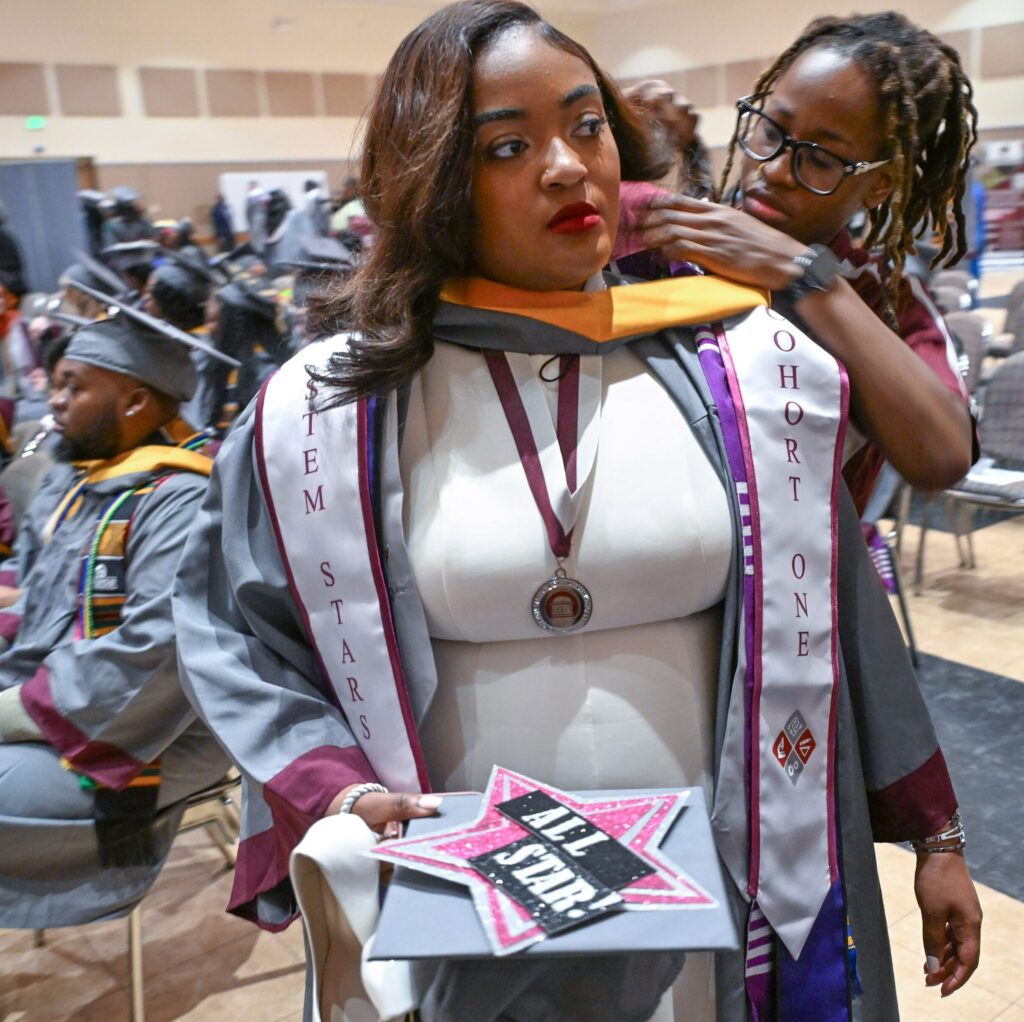 Biology major Victoria Casteel has her graduation stole adjusted before UMES' Spring 2026 Commencement.