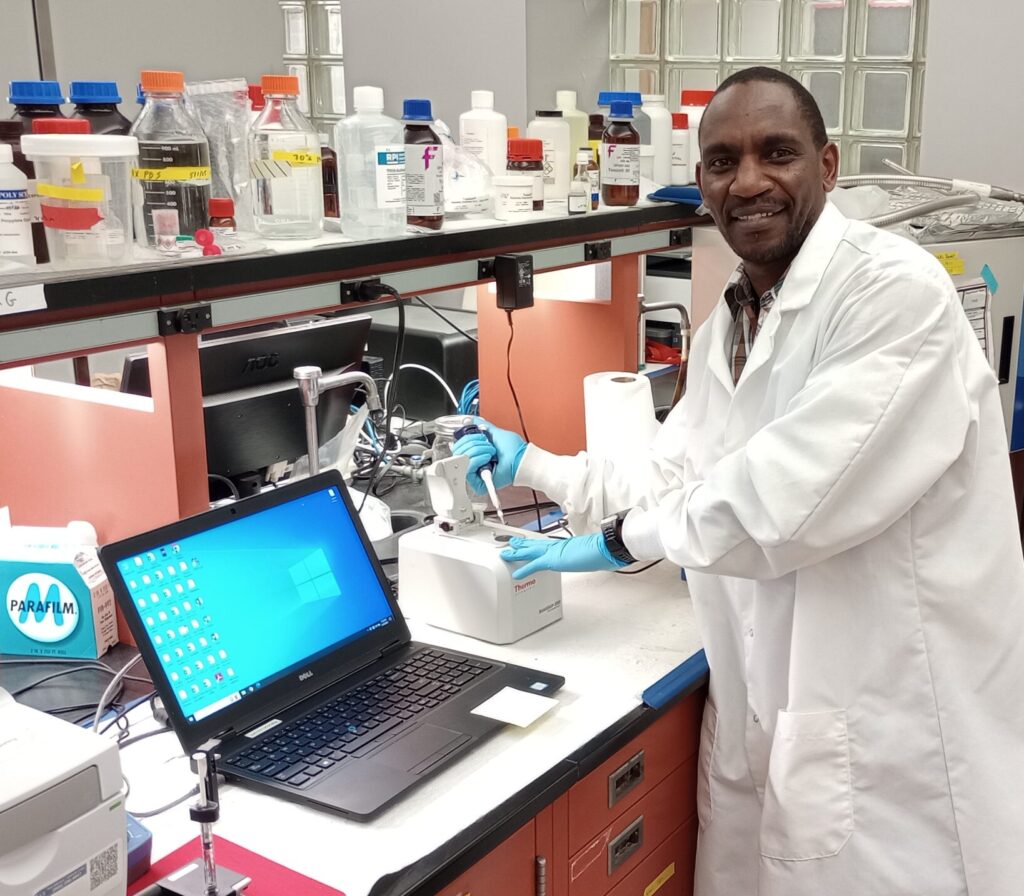 UMES alumnus Dr. Samuel Mwangi works in his poultry lab at North Carolina State University.