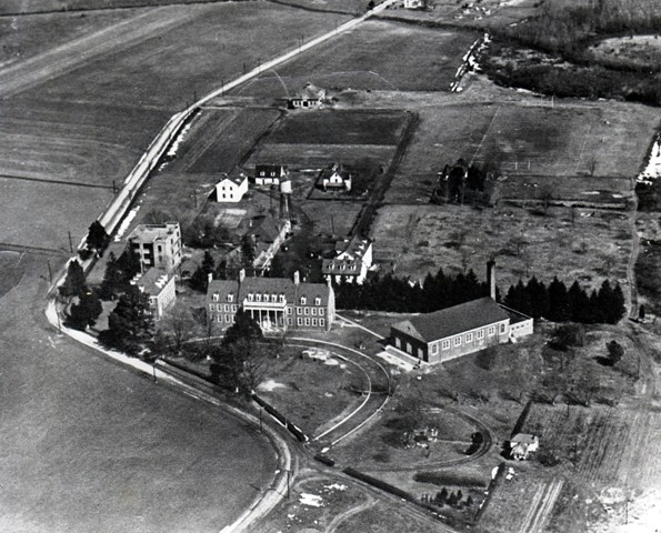 This 1941 view captures Princess Anne College as it was starting to be transformed by three new three brick structures in the foreground - Bird Hall, J.T. Williams Hall (formerly Maryland Hall) and Kiah gymnasium. This photo might have been taken in the winter because it appears snow is under shrubbery and along the serpentine College Backbone Road.