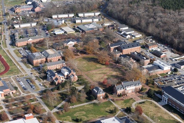 The focal point of this University of Maryland Eastern Shore image from 2010 shows a tree-lined Academic Oval with Frederick Douglass Library and George Washington Carver science hall completing the configuration adjacent to iconic Trigg Hall. The remnant of College Backbone Road is visible behind the library, while Hazel Hall sits adjacent to the site where the old Kiah gym once stood. (Joey Gardner photo)