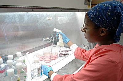 A student works in a campus lab. 