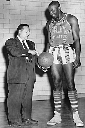 Tom "Tarzan" Spencer, right, with Abe Saperstein, founder of the Harlem Globetrotters