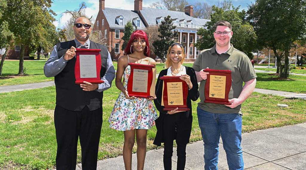 UMES students pose with their respective Award of Excellence Plaques