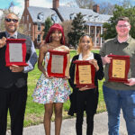 UMES students pose with their respective Award of Excellence Plaques