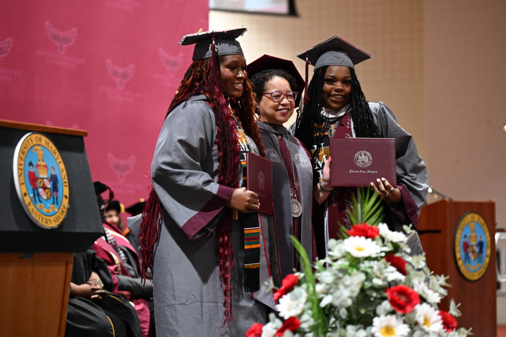 Graduating HBCU students embracing their university president.